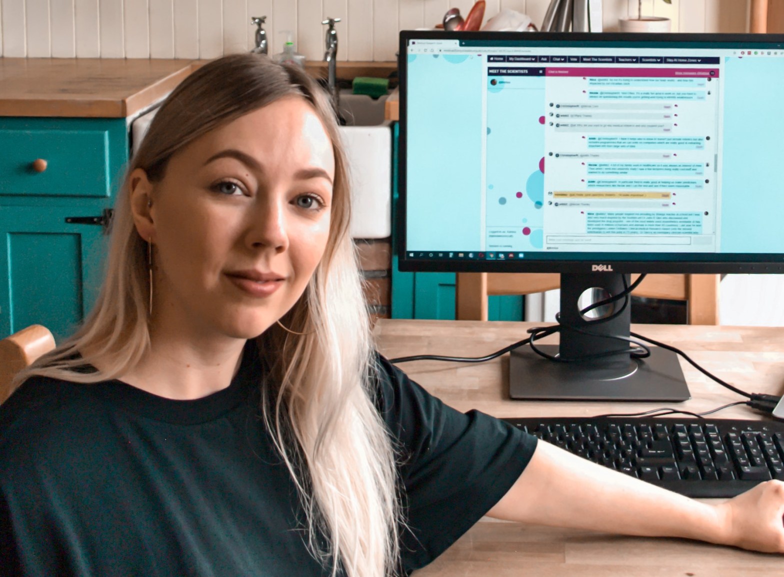 Photo of Katrina at her desk taking part in an I'm a Scientist online chat